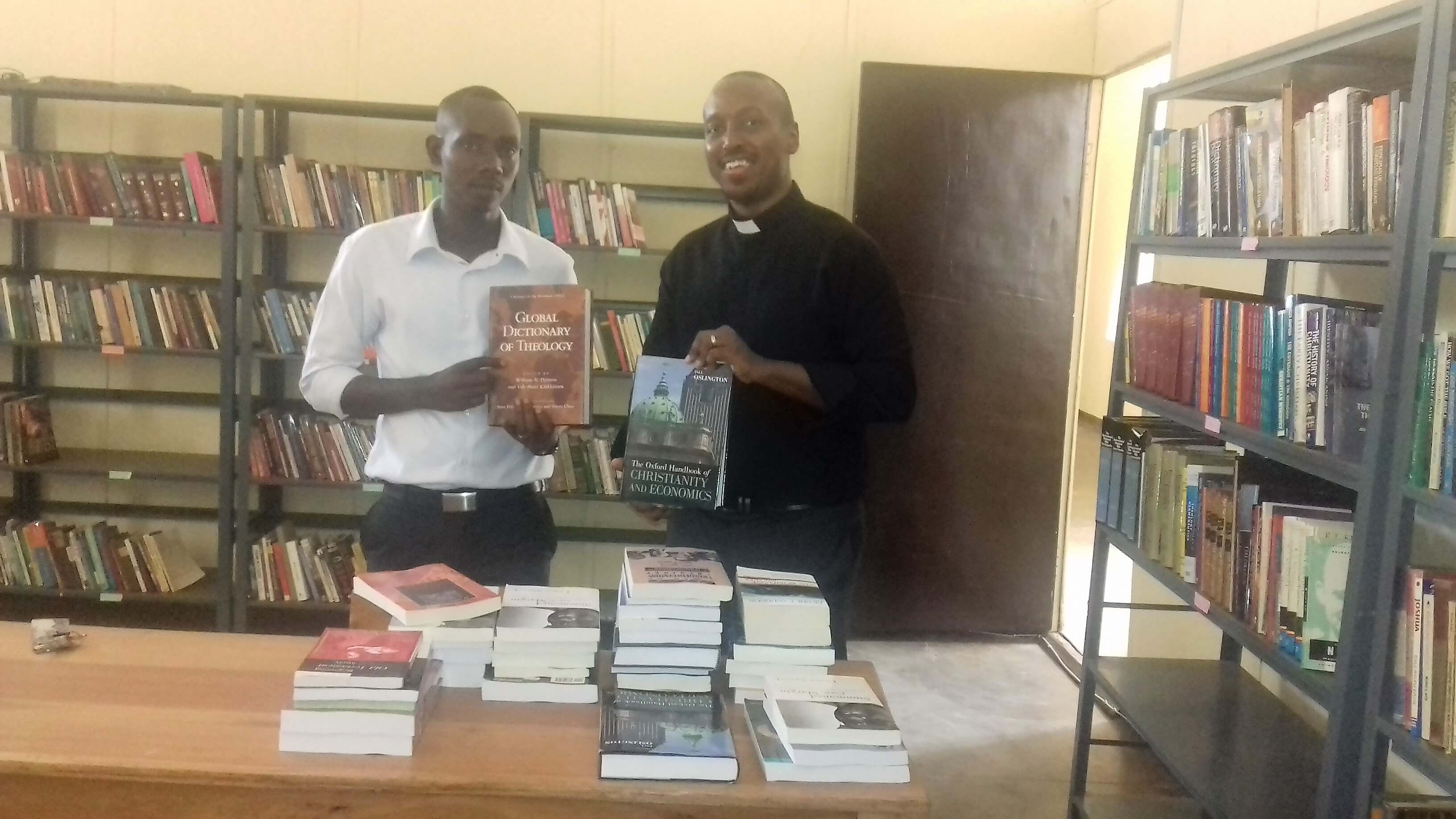 Appeal for Theological books. Rev Steve Muneza took out new Theological books to help equip BCU's library